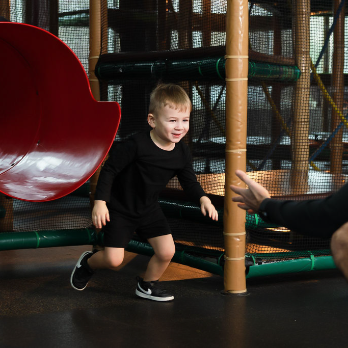 Adventure center child at end of slide